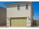 Exterior shot of two-story home with a garage and a bright green garage door at 15584 S 180Th Ln, Goodyear, AZ 85338