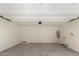 Spacious garage with high ceilings, neutral walls, and concrete flooring at 15584 S 180Th Ln, Goodyear, AZ 85338