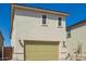 Exterior shot of two-story home with a garage and a bright green garage door at 15584 S 180Th Ln, Goodyear, AZ 85338