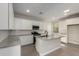 Well-equipped kitchen with white cabinets, granite countertops, and stainless steel appliances at 15584 S 180Th Ln, Goodyear, AZ 85338