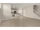 Bright and open living room area with tile flooring, white walls, and easy kitchen access at 15584 S 180Th Ln, Goodyear, AZ 85338