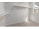 Walk-in closet features carpeted floor, shelving, and a window for natural light at 15584 S 180Th Ln, Goodyear, AZ 85338