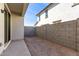 The backyard features a privacy wall and minimal landscaping, providing a blank canvas at 15586 S 181St Dr, Goodyear, AZ 85338
