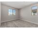 Bedroom with neutral walls, carpet, and dual windows for great light at 15586 S 181St Dr, Goodyear, AZ 85338