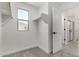 Walk in closet with carpeted floors, a window, and wooden clothes racks at 15586 S 181St Dr, Goodyear, AZ 85338