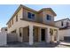 Charming two-story home with a cozy front porch and craftsman architectural details at 15586 S 181St Dr, Goodyear, AZ 85338