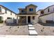 Charming two-story home with a cozy front porch and craftsman architectural details at 15586 S 181St Dr, Goodyear, AZ 85338