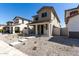 Charming two-story home with a cozy front porch and craftsman architectural details at 15586 S 181St Dr, Goodyear, AZ 85338