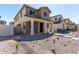 Charming two-story home with a cozy front porch and craftsman architectural details at 15586 S 181St Dr, Goodyear, AZ 85338