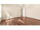 Cozy bedroom with hardwood floors and a doorway that leads to another room at 16802 N 20Th St, Phoenix, AZ 85022