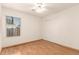 Bedroom with hardwood floors, a closet with sliding doors, and natural light from a window at 16802 N 20Th St, Phoenix, AZ 85022