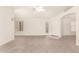 Spacious living room featuring tile flooring, a ceiling fan, and ample natural light at 16802 N 20Th St, Phoenix, AZ 85022