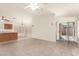Bright and spacious living room with a ceiling fan and sliding glass doors leading to the outdoors at 16802 N 20Th St, Phoenix, AZ 85022