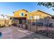 Spacious backyard featuring a stone patio, fenced pool, and cozy seating area at 17466 N 64Th Ave, Glendale, AZ 85308