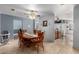 Dining room features a large wooden table with wood chairs and overhead fan at 17466 N 64Th Ave, Glendale, AZ 85308