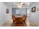Inviting dining room with a wooden table, chairs, and a ceiling fan at 17466 N 64Th Ave, Glendale, AZ 85308