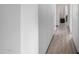 Hallway with wood laminate flooring at 17466 N 64Th Ave, Glendale, AZ 85308