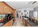 Long kitchen showcasing tile flooring, stainless steel appliances, and granite countertops at 17466 N 64Th Ave, Glendale, AZ 85308