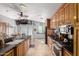 Well-lit kitchen featuring granite countertops, stainless steel appliances, and ample cabinet space at 17466 N 64Th Ave, Glendale, AZ 85308
