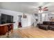 Open-concept living area with hardwood floors and staircase leading to upper level at 17466 N 64Th Ave, Glendale, AZ 85308