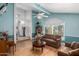 Bright living room with large window, hardwood floors, and comfortable seating arrangement at 17466 N 64Th Ave, Glendale, AZ 85308