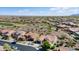 Well-maintained neighborhood featuring single-Gathering homes, desert landscaping, golf course, and tile roofs at 20453 N 264Th Ave, Buckeye, AZ 85396