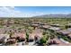 Spacious neighborhood with mountain views, showcasing desert landscaping, tile roofs, and single-Gathering homes at 20453 N 264Th Ave, Buckeye, AZ 85396