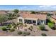 Inviting backyard featuring a patio, fire pit, lush desert landscaping, and comfortable seating area at 20453 N 264Th Ave, Buckeye, AZ 85396