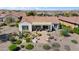 Inviting backyard featuring a patio, fire pit, lush desert landscaping, and comfortable seating area at 20453 N 264Th Ave, Buckeye, AZ 85396