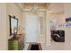Bright foyer with stylish decor, including a unique chandelier and an eye-catching mirror at 20453 N 264Th Ave, Buckeye, AZ 85396