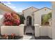 Inviting front entrance with mature foliage and a secure gated walkway at 20453 N 264Th Ave, Buckeye, AZ 85396