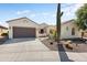 Attractive exterior view of a well-maintained single-story house with desert landscaping at 20453 N 264Th Ave, Buckeye, AZ 85396