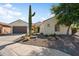 Charming single-story home with a desert-landscaped front yard and inviting curb appeal at 20453 N 264Th Ave, Buckeye, AZ 85396