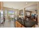 Open concept kitchen features an island with granite countertops, flowing into the breakfast nook at 20453 N 264Th Ave, Buckeye, AZ 85396