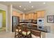 Bright kitchen features stainless steel appliances, granite countertops, and a large island with seating at 20453 N 264Th Ave, Buckeye, AZ 85396