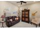 Relaxing living room with a comfortable couch and a unique cabinet feature at 20453 N 264Th Ave, Buckeye, AZ 85396
