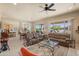 Open-concept living room featuring comfortable seating and seamless transition to dining area at 20453 N 264Th Ave, Buckeye, AZ 85396