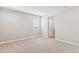 Bright bedroom with neutral carpet, a window, and an ensuite bathroom for added convenience at 21232 N 58Th St, Phoenix, AZ 85054