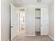 A bedroom with neutral walls, featuring open closet and connecting bathroom at 21232 N 58Th St, Phoenix, AZ 85054