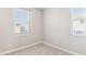 Inviting bedroom with a window, plush carpeting, and neutral walls, creates a cozy ambiance at 21232 N 58Th St, Phoenix, AZ 85054