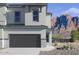 Charming two-story home featuring a desert landscape, neutral paint scheme, and a two-car garage, set against a majestic mountain backdrop at 21232 N 58Th St, Phoenix, AZ 85054