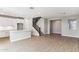 Spacious kitchen with white cabinets, a center island, and stainless steel appliances, seamlessly integrated with the adjacent living areas at 21232 N 58Th St, Phoenix, AZ 85054