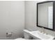 Bathroom featuring a white pedestal sink and modern fixtures at 21248 N 58Th St, Phoenix, AZ 85054