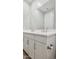 Bathroom with double sink vanity, featuring white countertops, shaker cabinets, and brushed nickel hardware at 21248 N 58Th St, Phoenix, AZ 85054