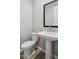 Bathroom featuring a white pedestal sink and modern fixtures at 21248 N 58Th St, Phoenix, AZ 85054