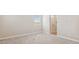 This bedroom has neutral paint, carpeted floors, and a window next to a bathroom at 21248 N 58Th St, Phoenix, AZ 85054