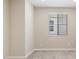 Bedroom featuring neutral walls, carpet floors, and a window with blinds at 21248 N 58Th St, Phoenix, AZ 85054