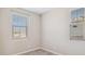 Bright bedroom featuring plush carpet and two windows with natural light and neutral walls at 21248 N 58Th St, Phoenix, AZ 85054