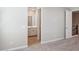 Neutral paint, carpeted floors, an ensuite bathroom, and closet access in this bedroom at 21248 N 58Th St, Phoenix, AZ 85054