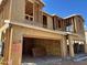 This is a two-story house under construction featuring wood framing and OSB sheathing with a garage entrance at 21248 N 58Th St, Phoenix, AZ 85054